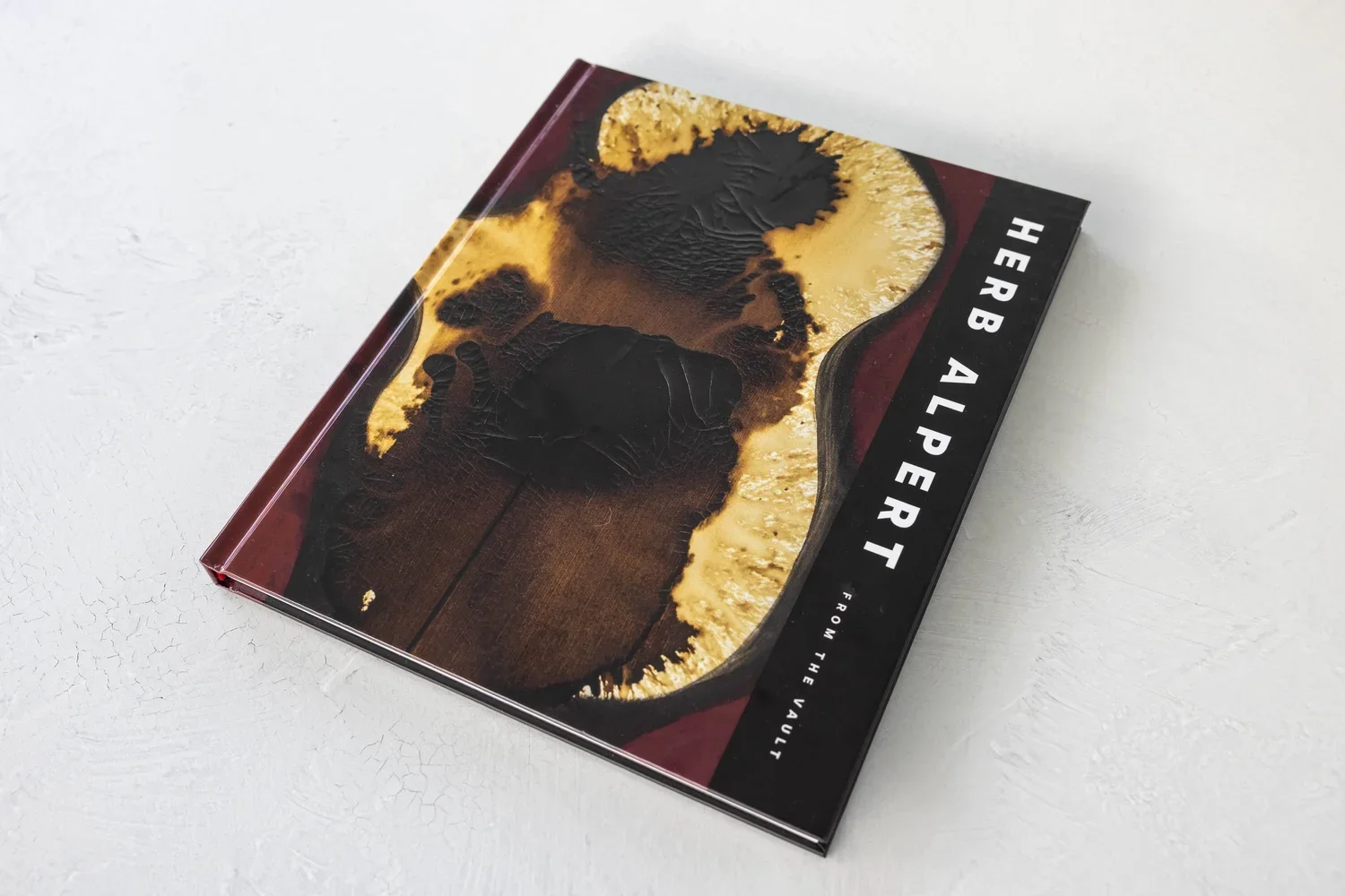 Herb Alpert hardcover coffee table book with a gold and black sculpture on the cover
